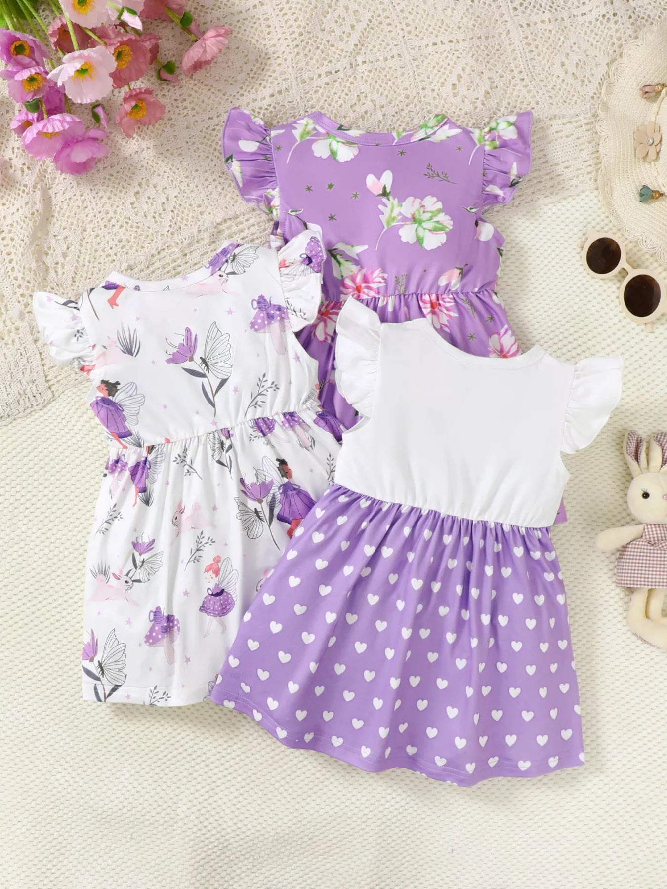 Three piece lavender girls dress set with fairy print, floral print, and heart print ruffle sleeve dresses