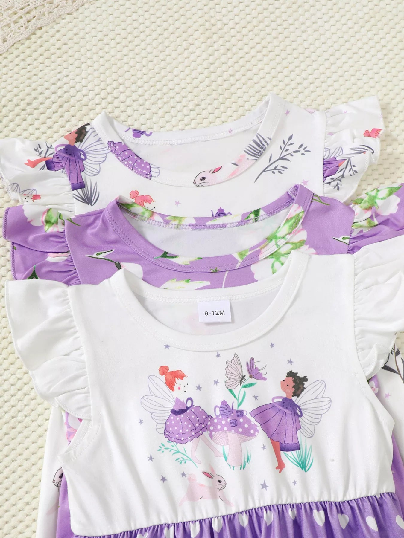 Three piece lavender girls dress set with fairy print, floral print, and heart print ruffle sleeve dresses