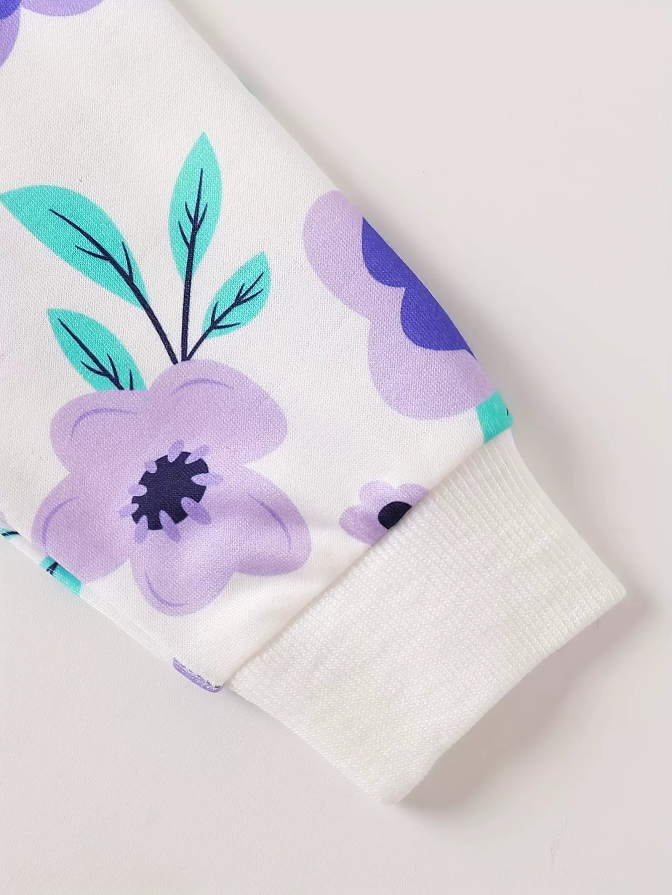 Children’s purple floral two-piece outfit with long sleeve top and leggings