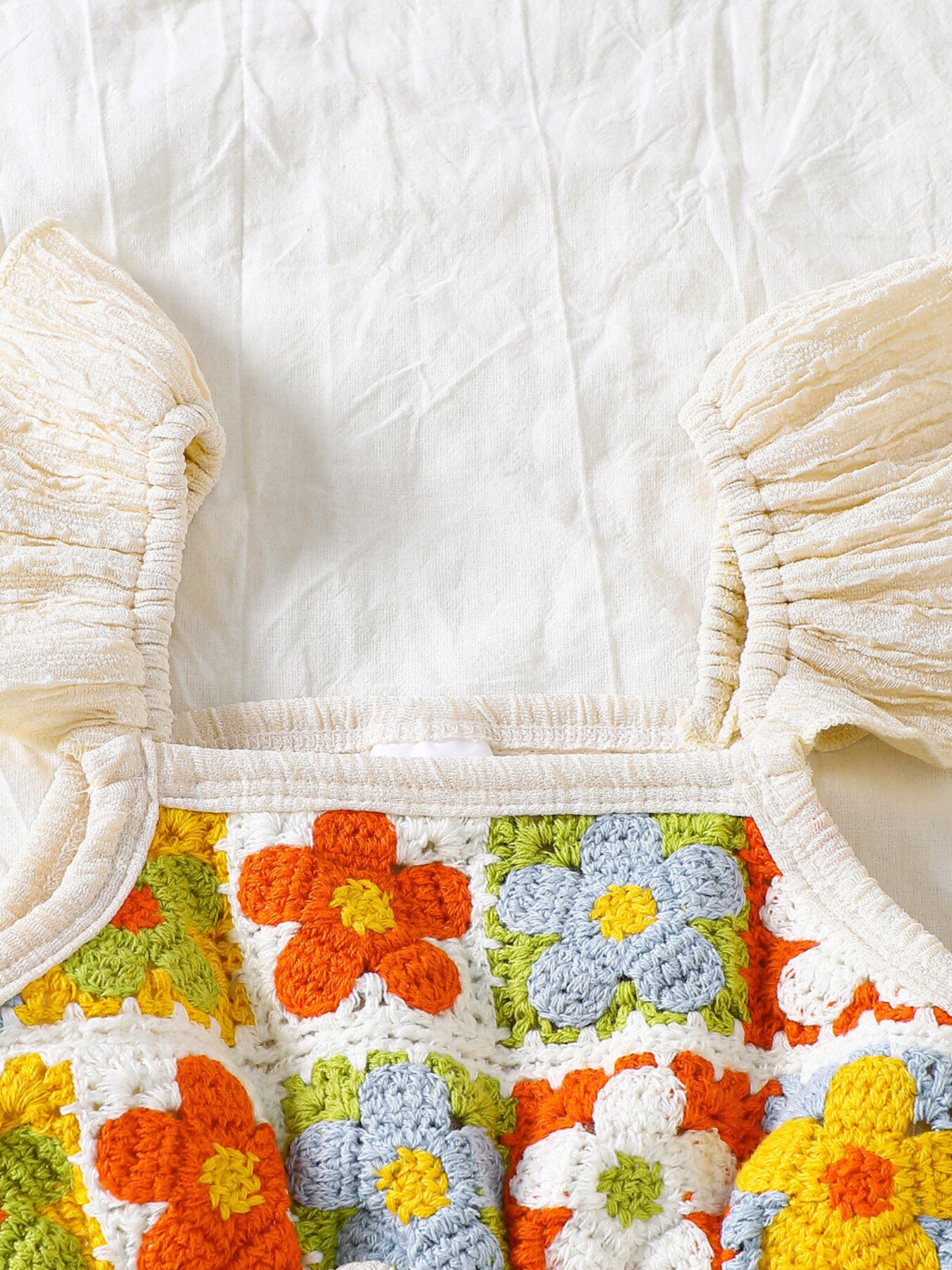Kids bell-leg jumpsuit with crochet patchwork bodice and flutter straps