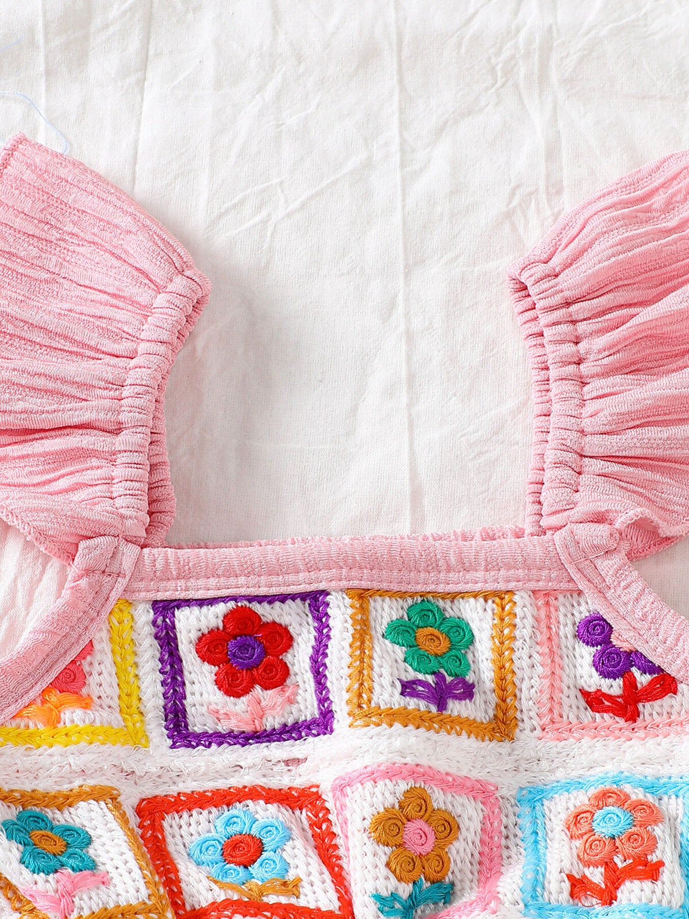 Kids bell-leg jumpsuit with crochet patchwork bodice and flutter straps