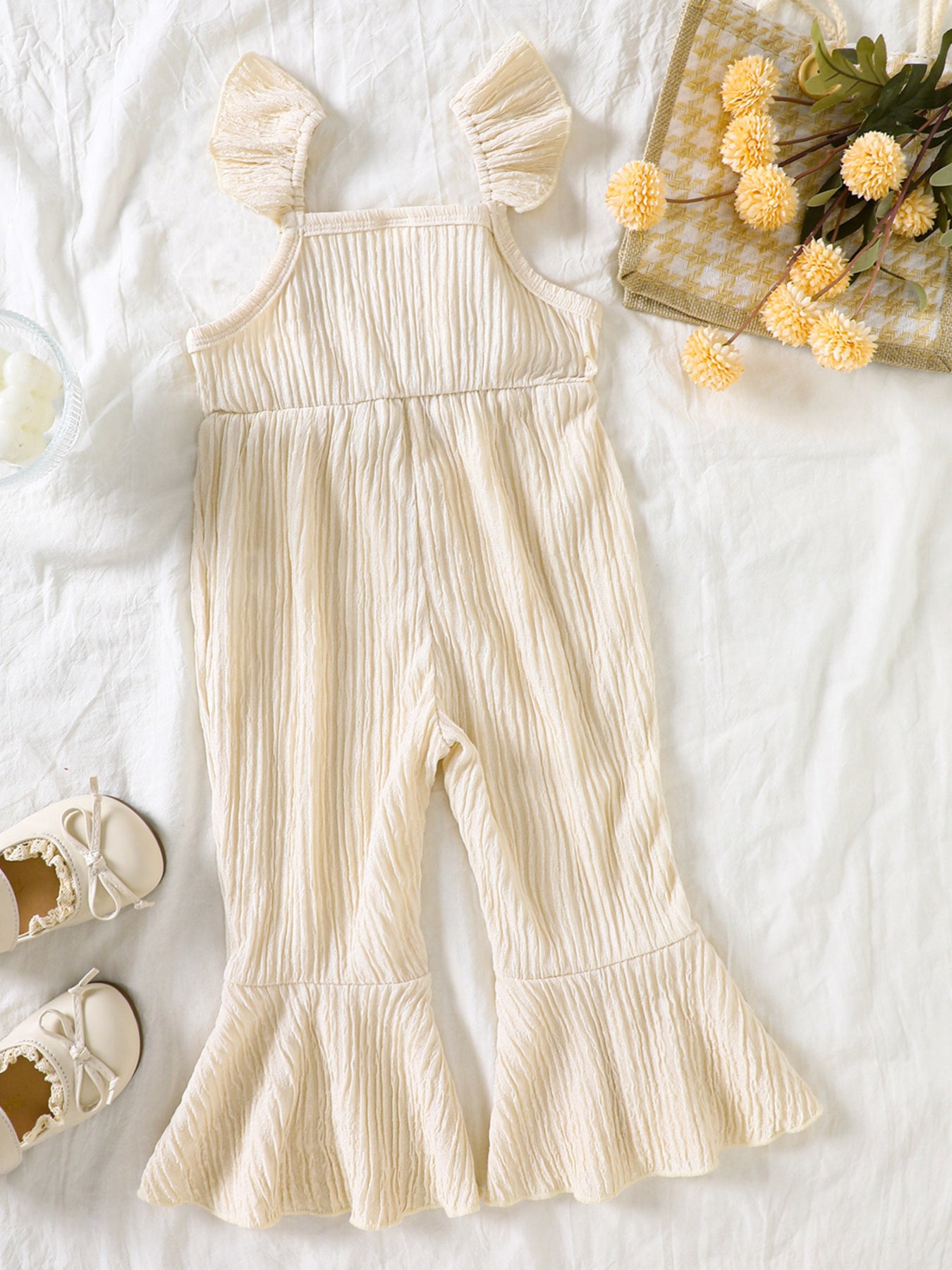 Kids bell-leg jumpsuit with crochet patchwork bodice and flutter straps