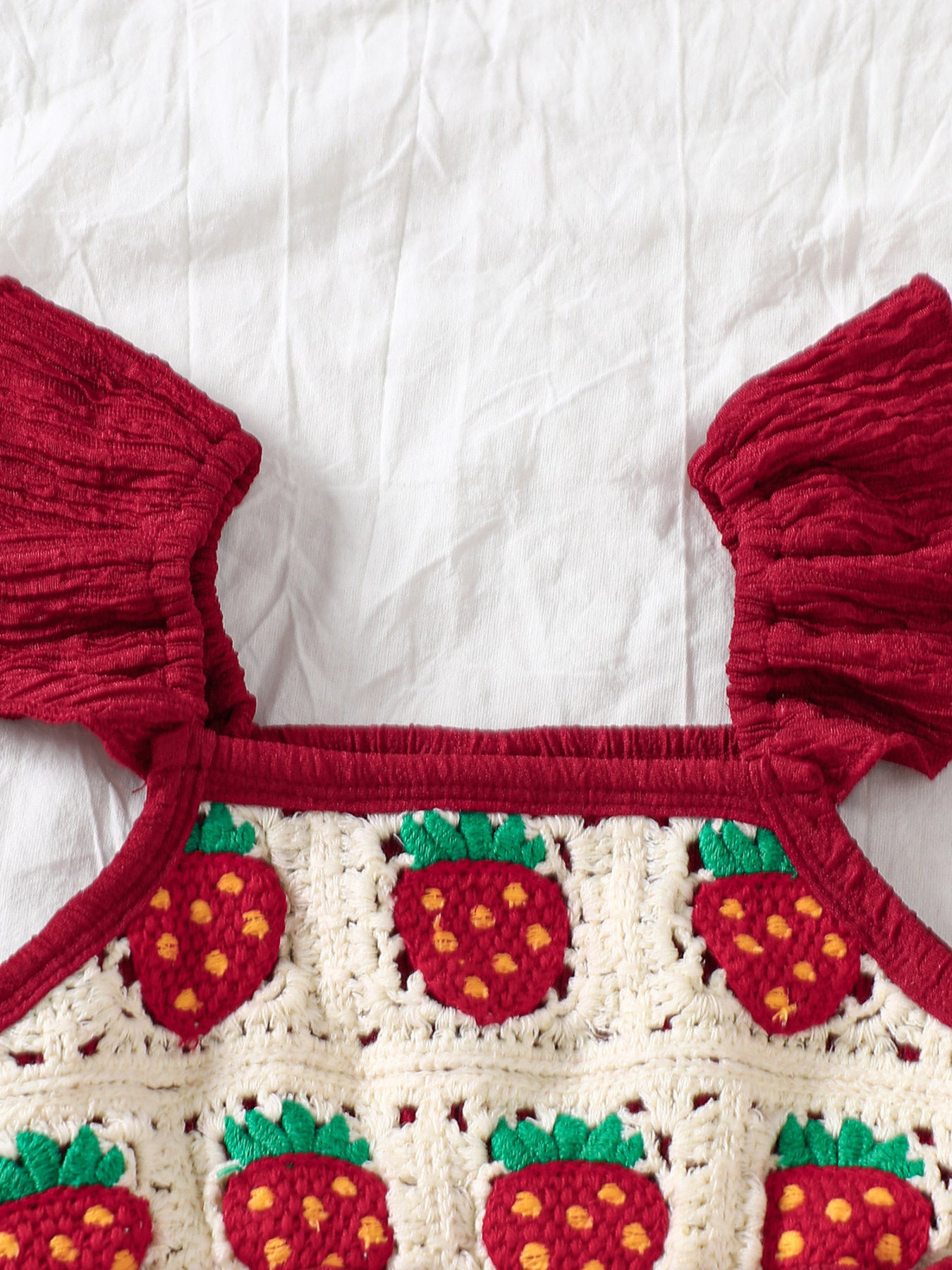 Kids bell-leg jumpsuit with crochet patchwork bodice and flutter straps