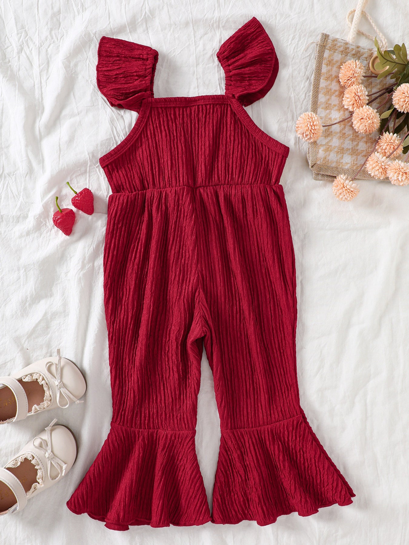 Kids bell-leg jumpsuit with crochet patchwork bodice and flutter straps