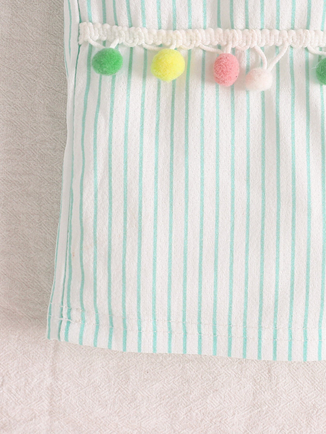 Kids two-piece outfit with rainbow applique top and striped pom-pom trim pants