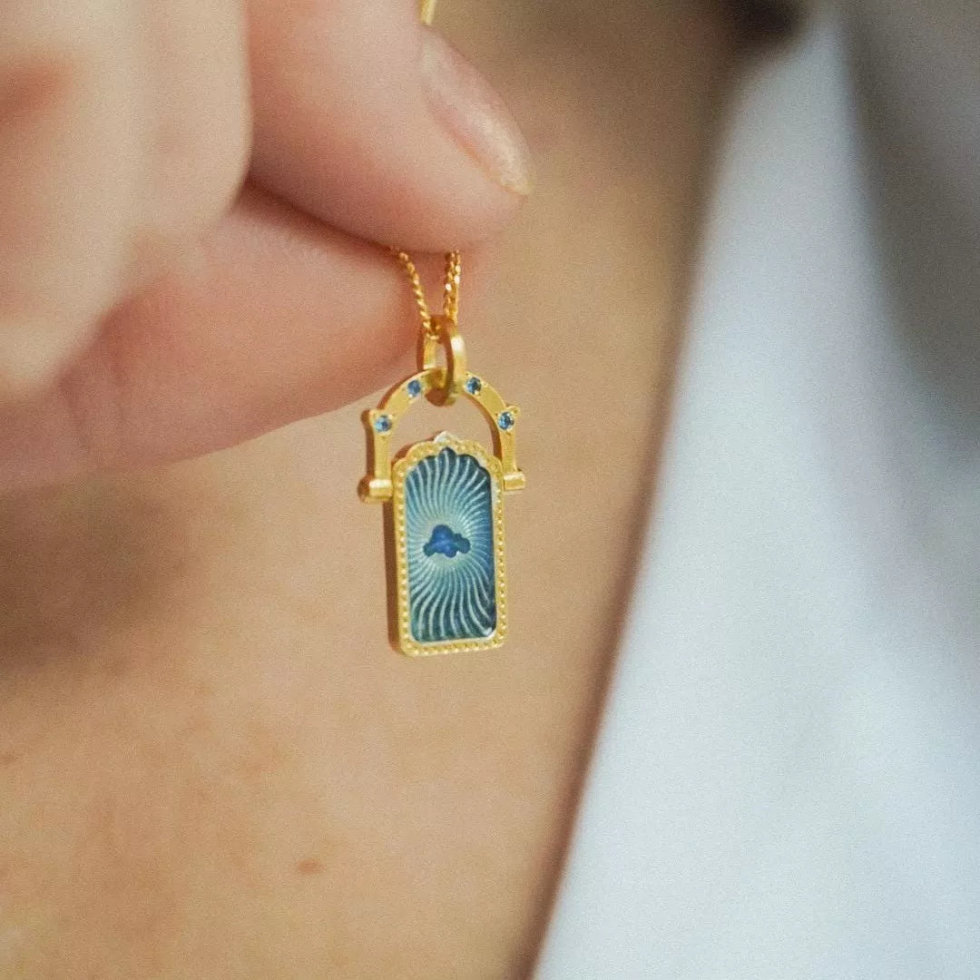 Lucky Charms Pendant Necklace with blue cloud charm on gold-plated chain