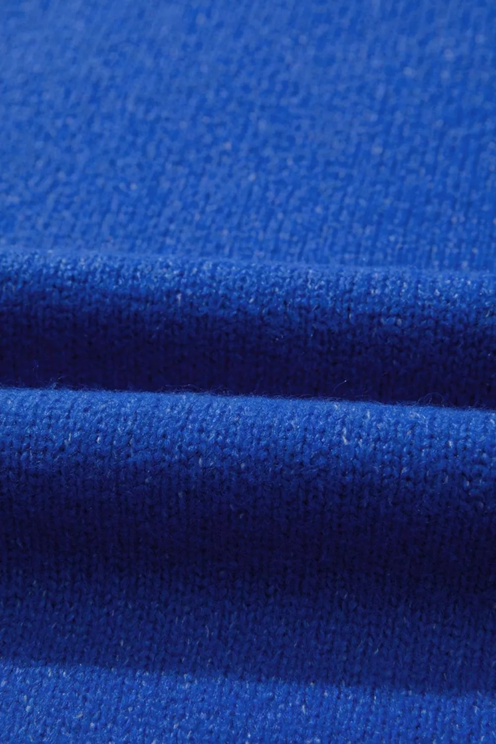 Blue knit sweater with duck graphic, relaxed off-shoulder neckline, ribbed trim, and soft slightly stretchy recycled-blend fabric.