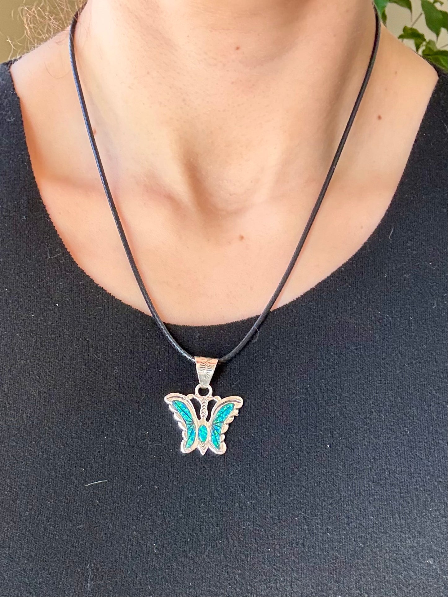 Sterling silver opal butterfly pendant with blue-green opal inlay from the Enchanted Crystals Collection.