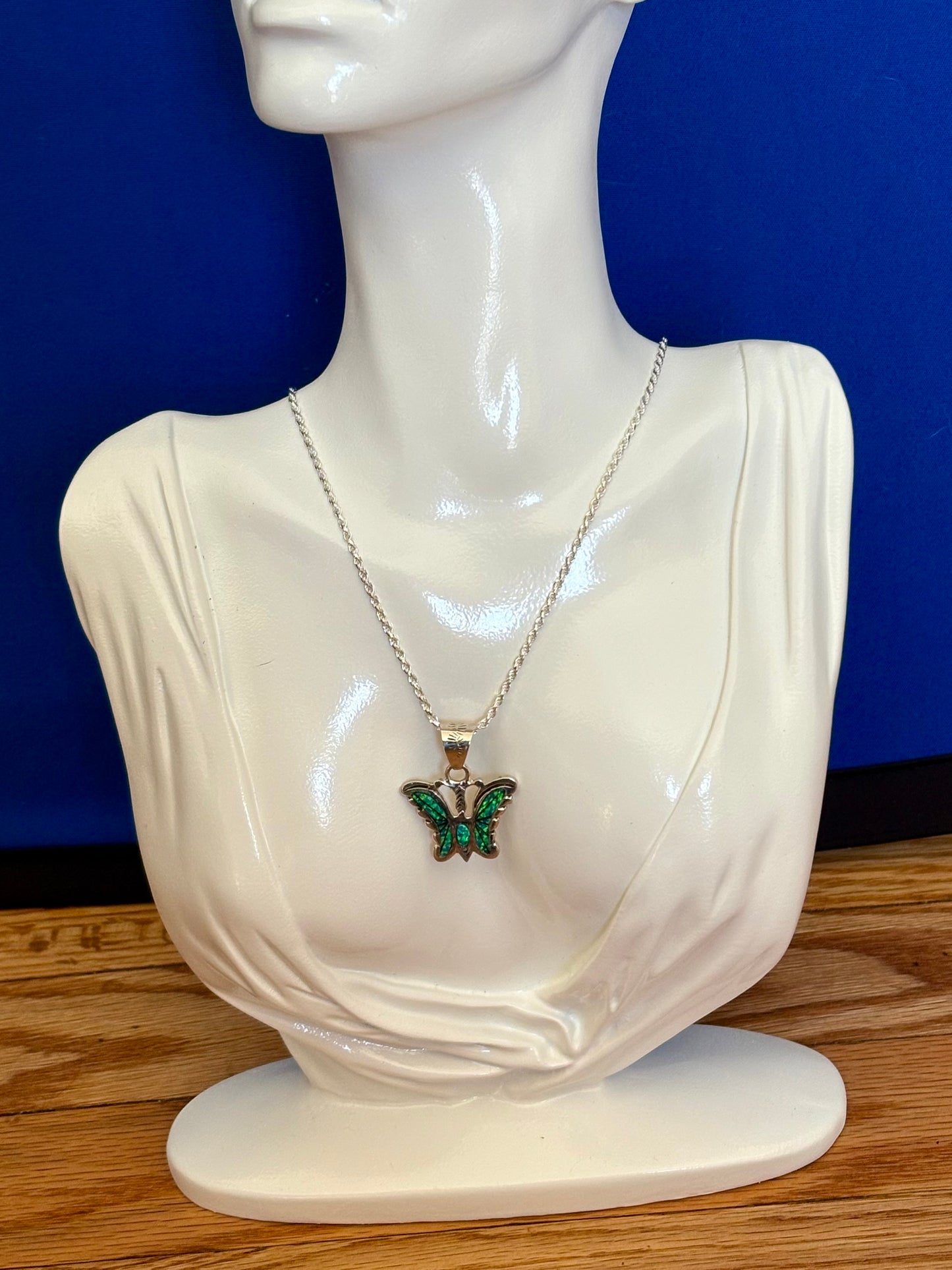 Sterling silver opal butterfly pendant with blue-green opal inlay from the Enchanted Crystals Collection.