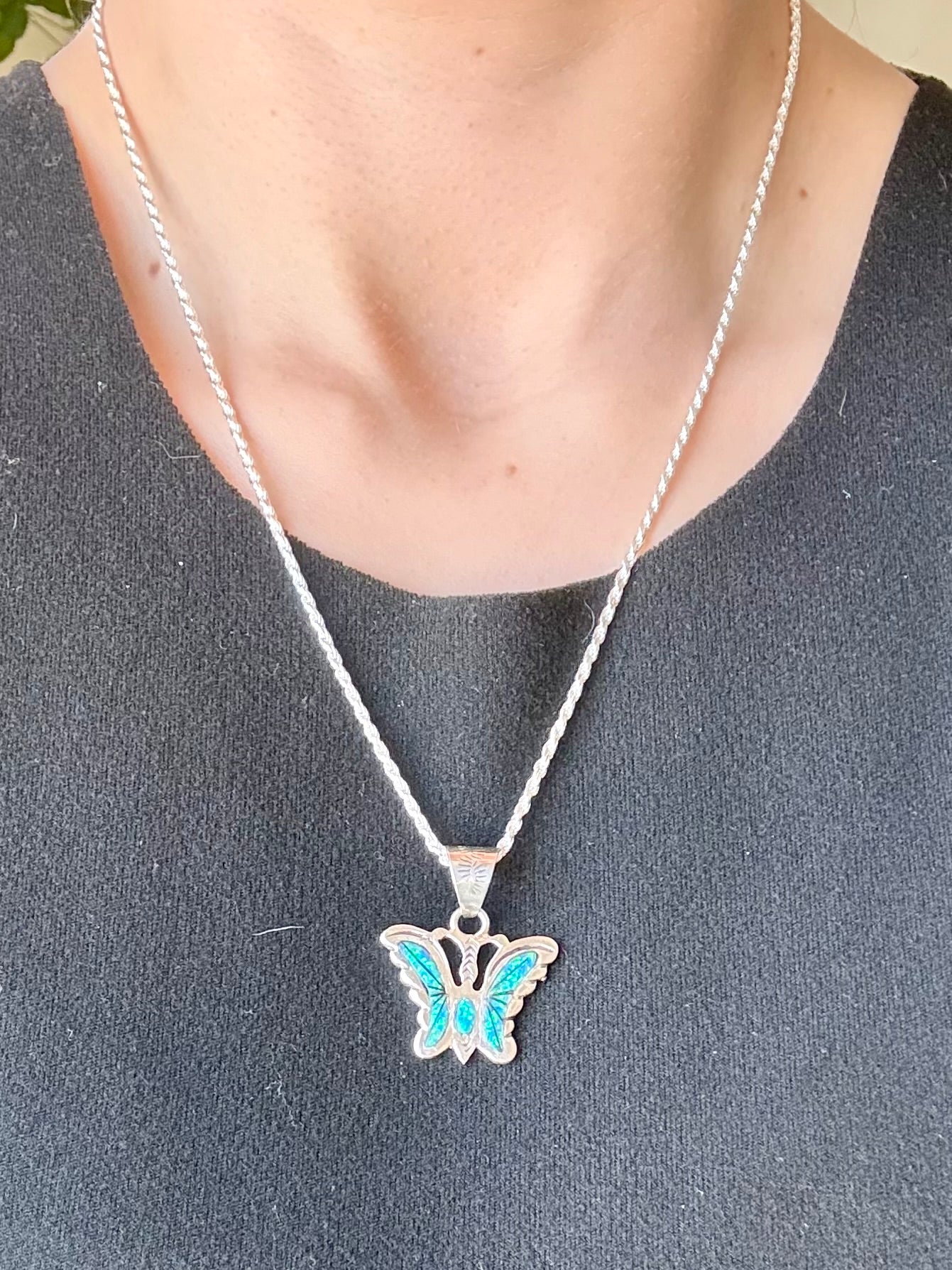 Sterling silver opal butterfly pendant with blue-green opal inlay from the Enchanted Crystals Collection.