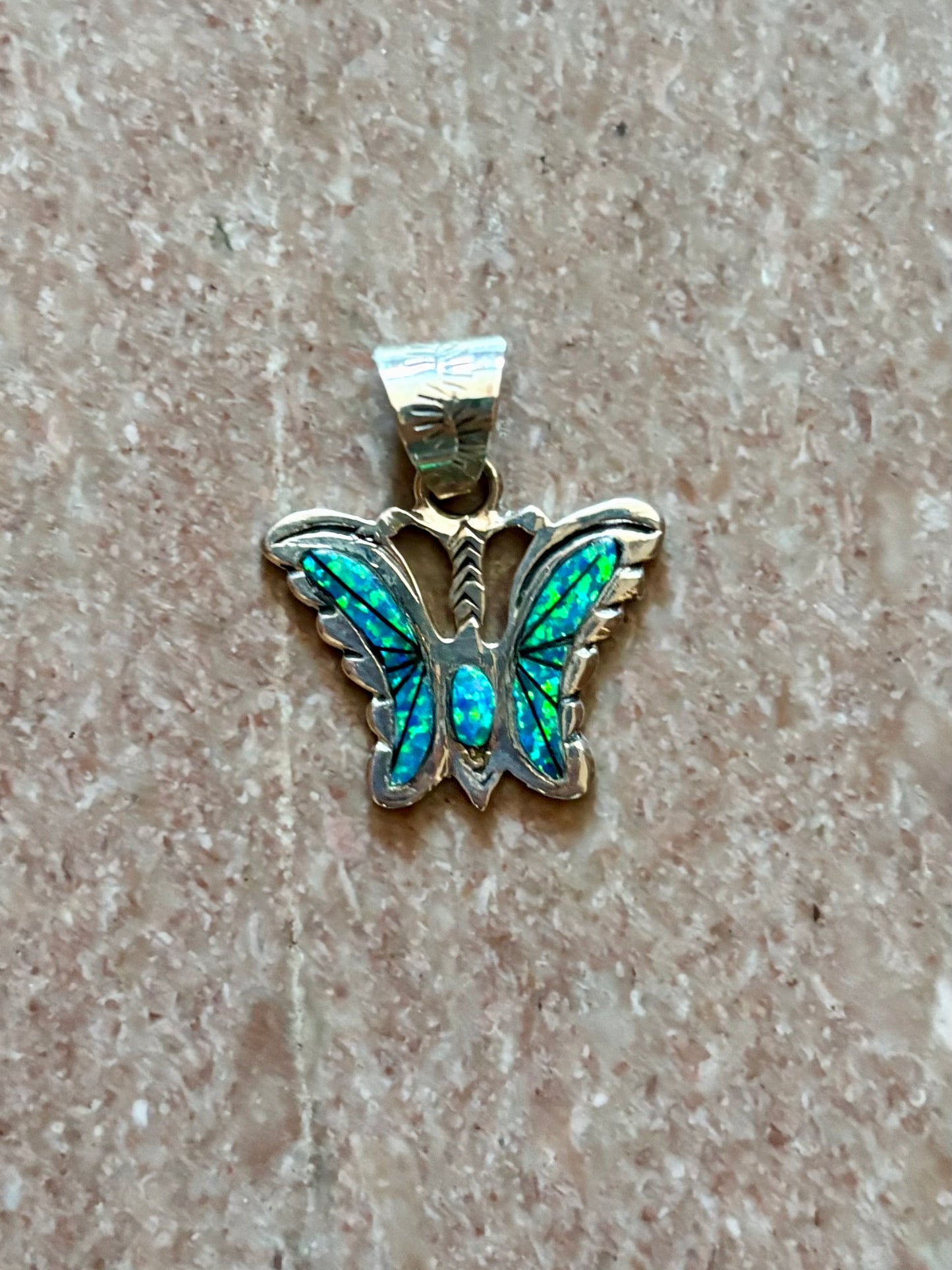 Sterling silver opal butterfly pendant with blue-green opal inlay from the Enchanted Crystals Collection.