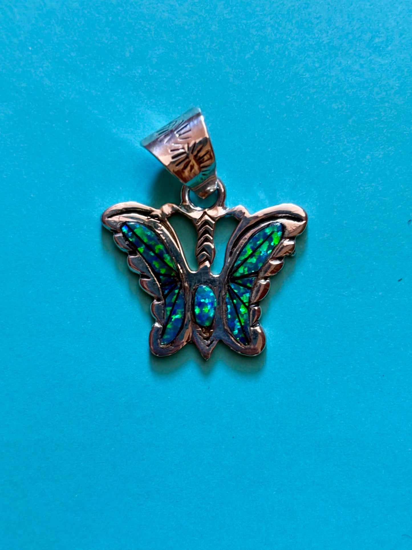 Sterling silver opal butterfly pendant with blue-green opal inlay from the Enchanted Crystals Collection.