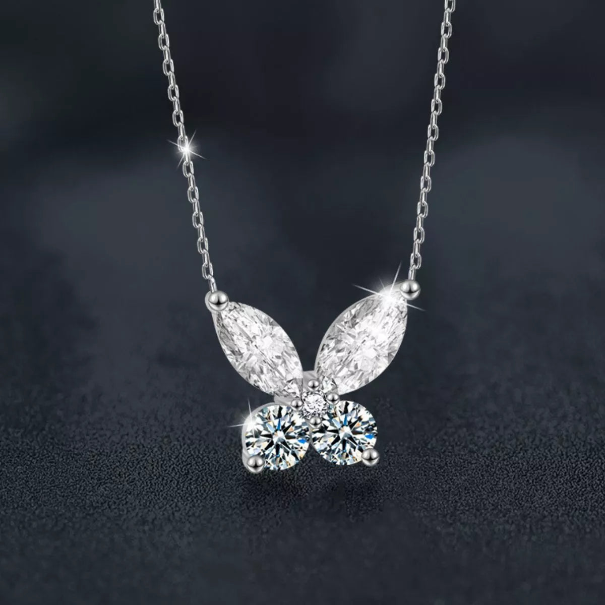 Butterfly-shaped moissanite pendant necklace in platinum-plated sterling silver.