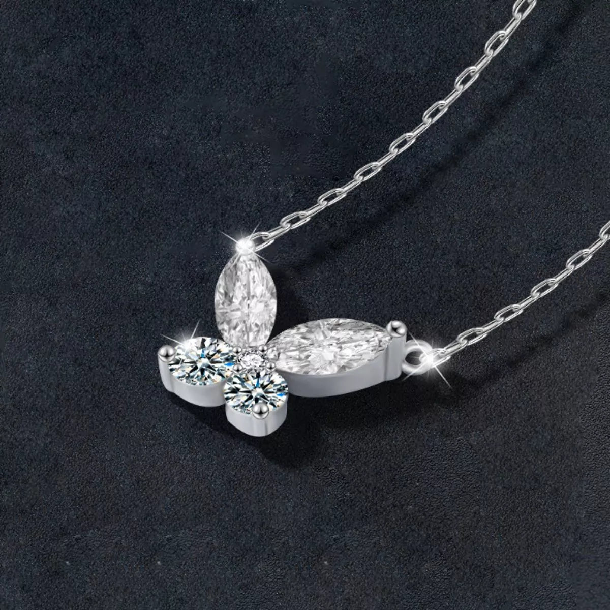 Butterfly-shaped moissanite pendant necklace in platinum-plated sterling silver.