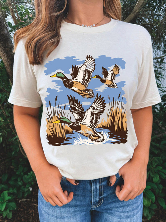 Cream graphic t shirt with flying mallard ducks and marsh scene print