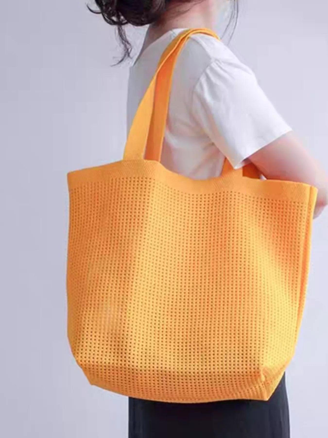 Large mesh shoulder tote bag made from lightweight polyester, perfect for beach days, markets, travel, and everyday errands.