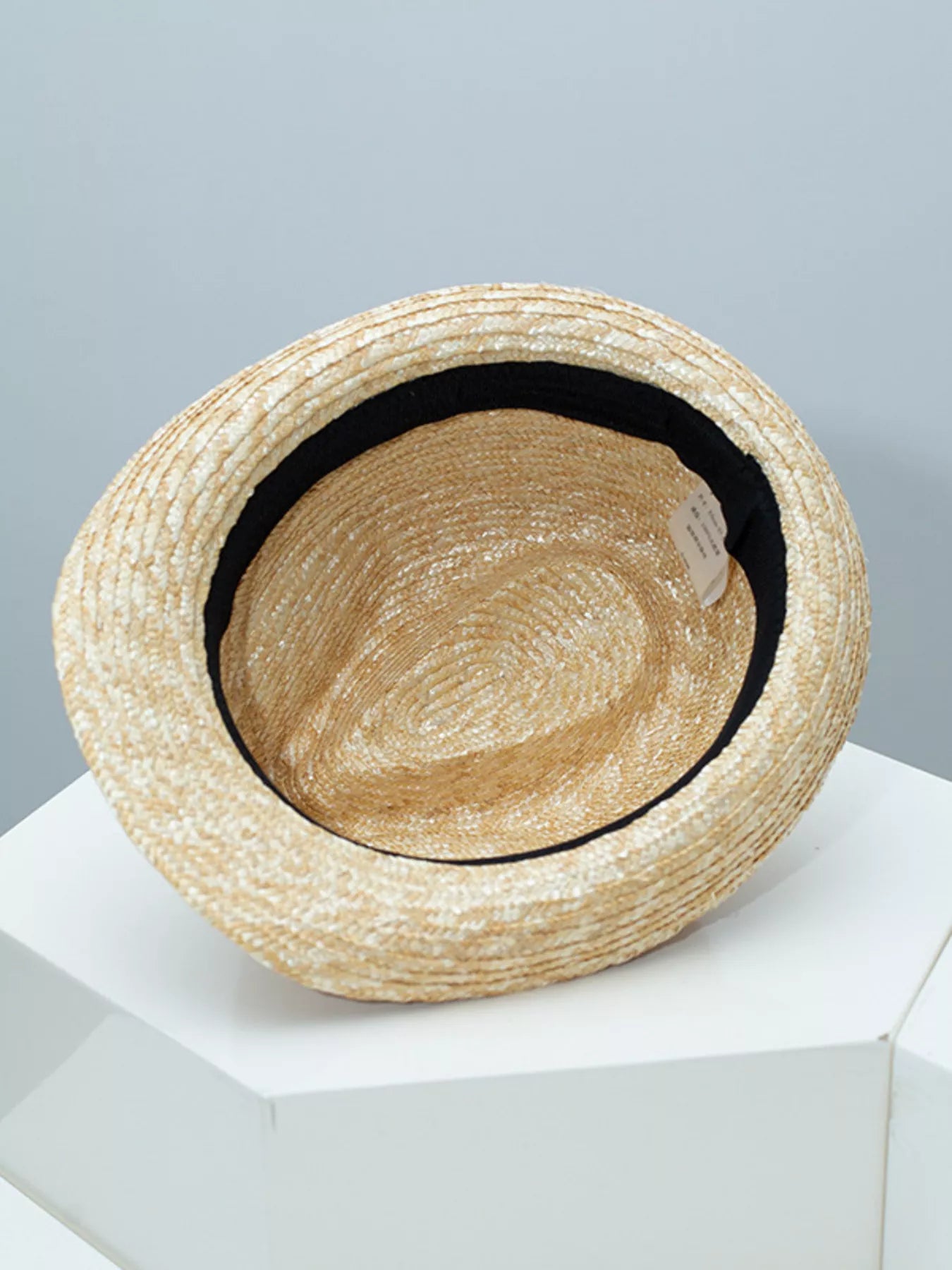 woven straw hat with colorful boho band detail and classic brimmed shape