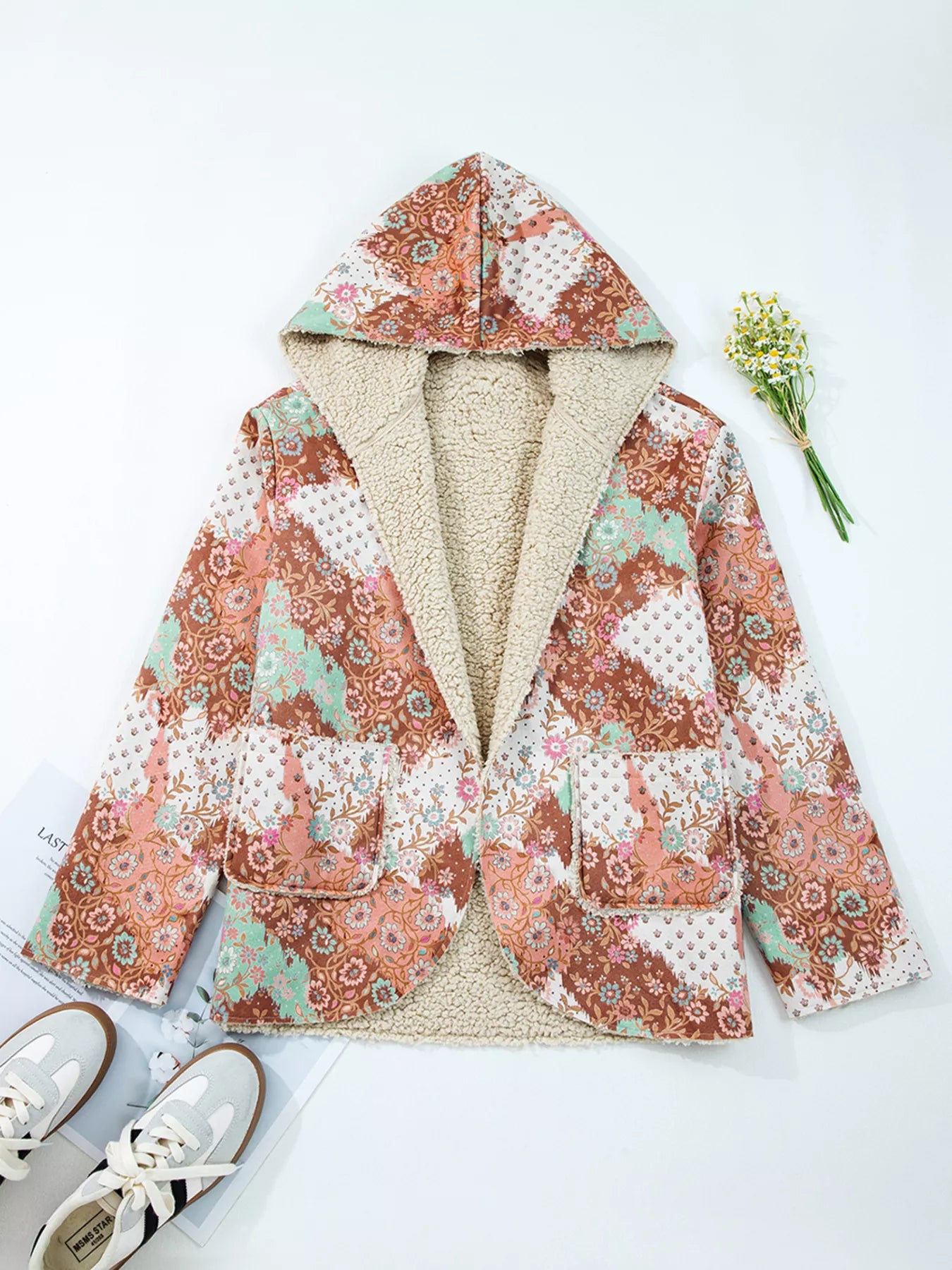 Meadow Bloom Sherpa Jacket – oversized floral printed hooded coat with sherpa lining and front pockets.