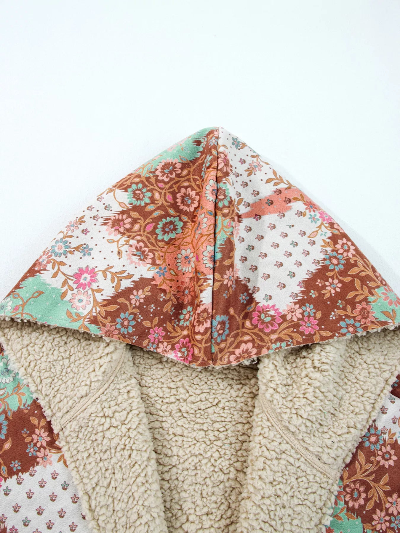 Meadow Bloom Sherpa Jacket – oversized floral printed hooded coat with sherpa lining and front pockets.