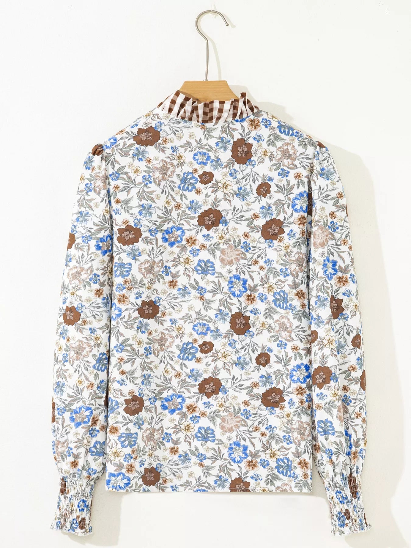 Floral blouse with gingham ruffle V-neckline and frilled sleeves styled with blue jeans