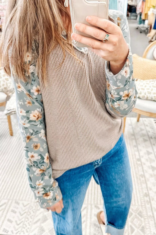 Ribbed knit top with floral long sleeves styled casually with jeans for everyday wear