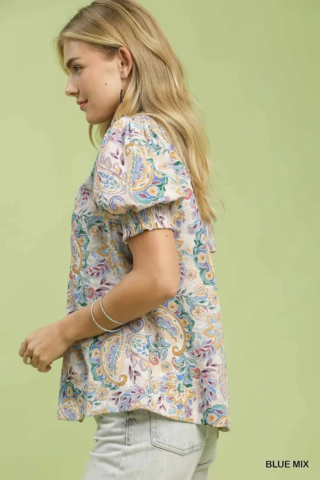 lightweight paisley floral boho blouse with puff sleeves and ruffled neckline in soft pastel tones