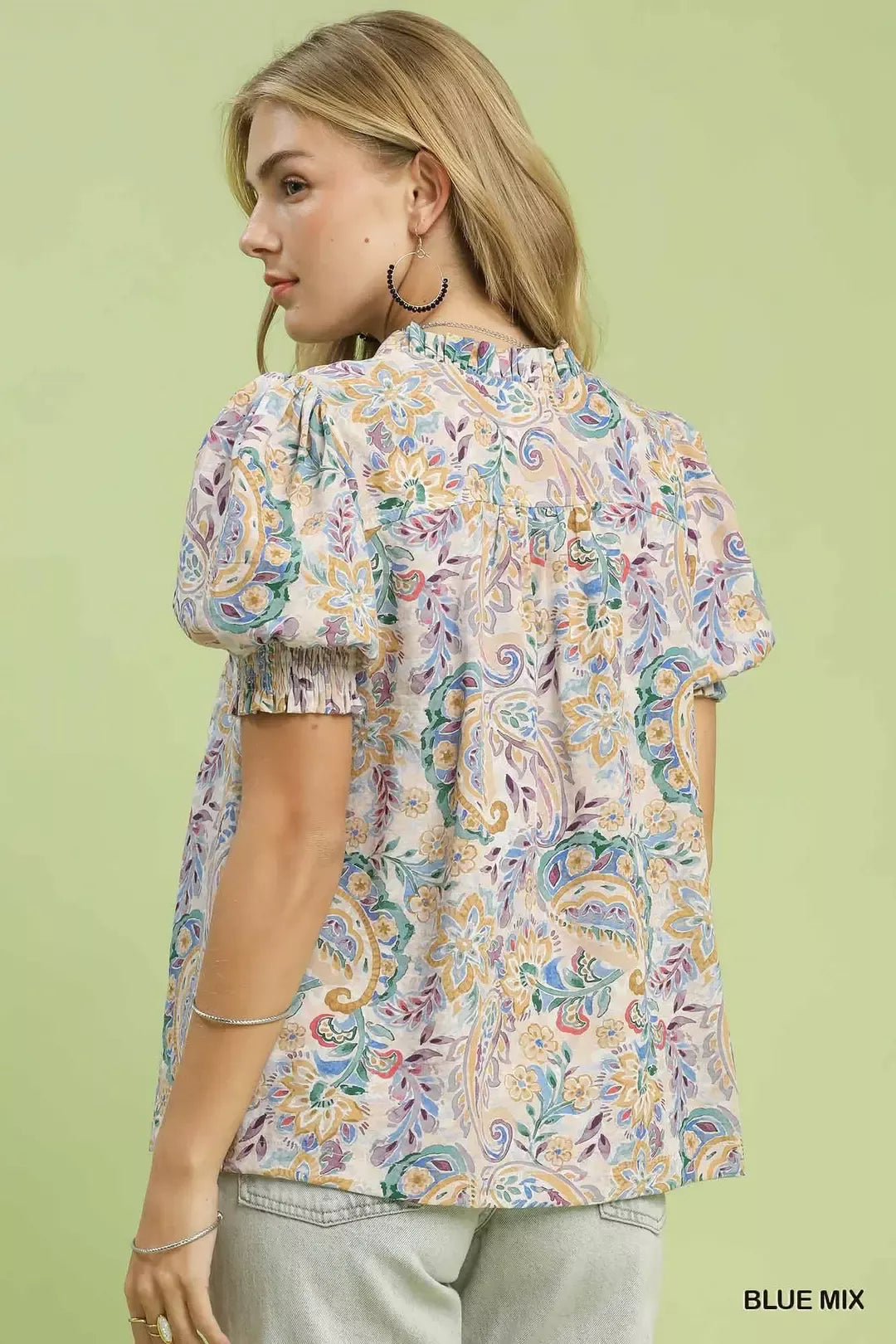 lightweight paisley floral boho blouse with puff sleeves and ruffled neckline in soft pastel tones