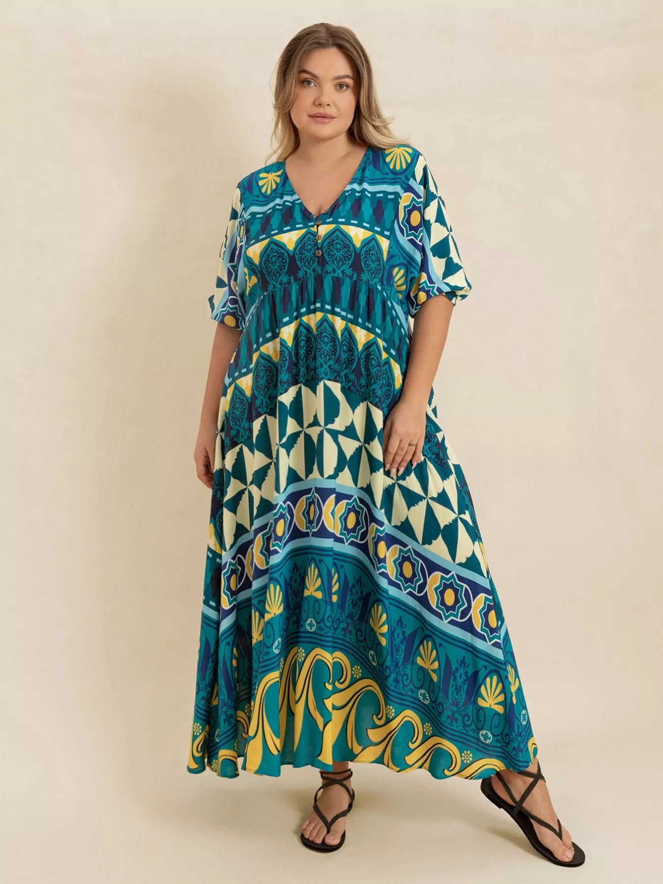 Plus size Mediterranean print midi dress in teal, turquoise, and yellow with buttoned V-neckline and flowy fit