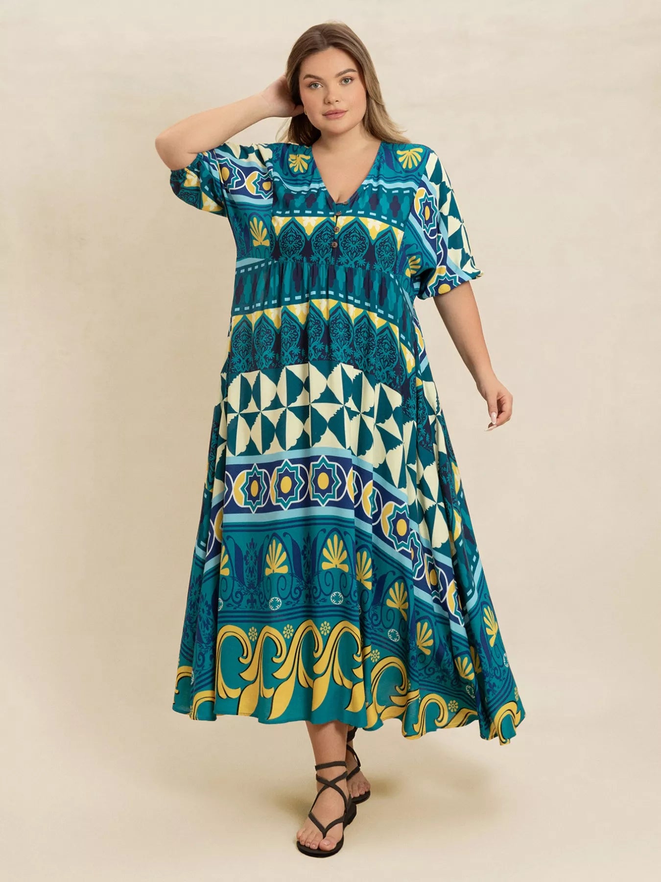 Plus size Mediterranean print midi dress in teal, turquoise, and yellow with buttoned V-neckline and flowy fit
