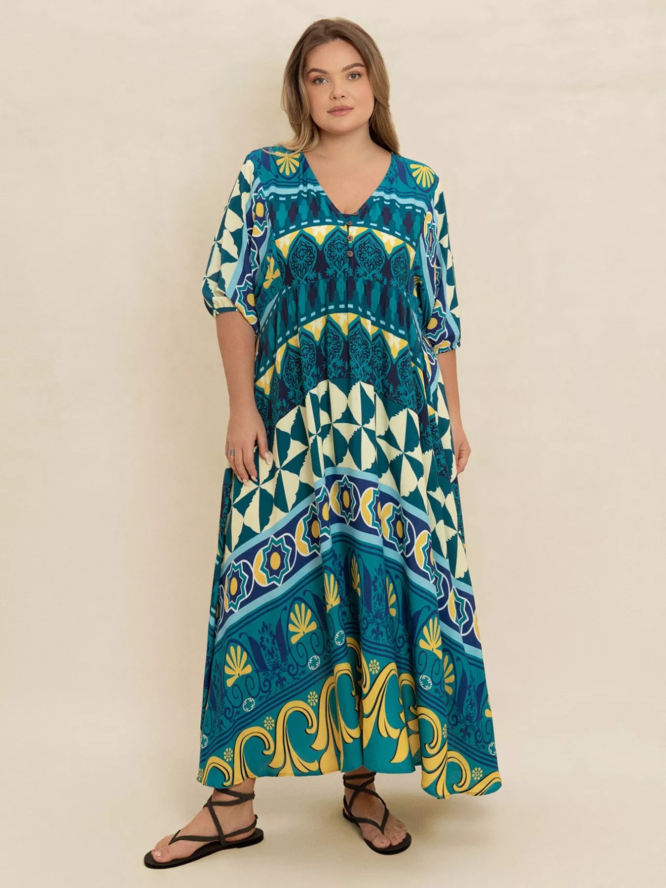 Plus size Mediterranean print midi dress in teal, turquoise, and yellow with buttoned V-neckline and flowy fit