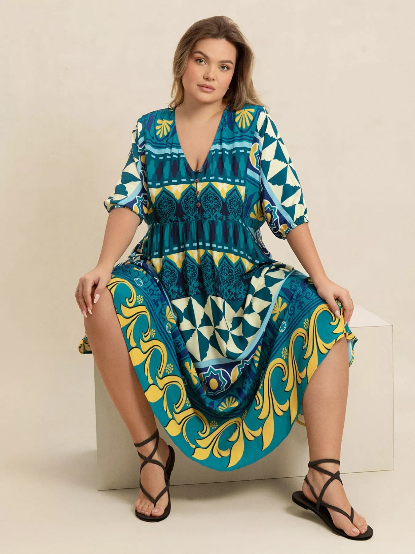 Plus size Mediterranean print midi dress in teal, turquoise, and yellow with buttoned V-neckline and flowy fit