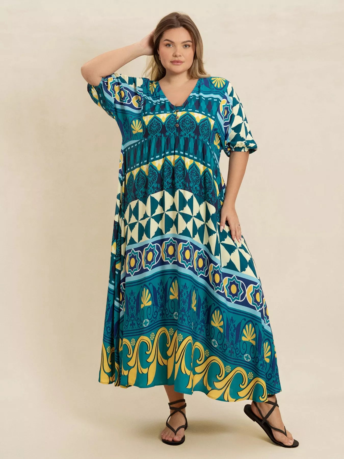 Plus size Mediterranean print midi dress in teal, turquoise, and yellow with buttoned V-neckline and flowy fit