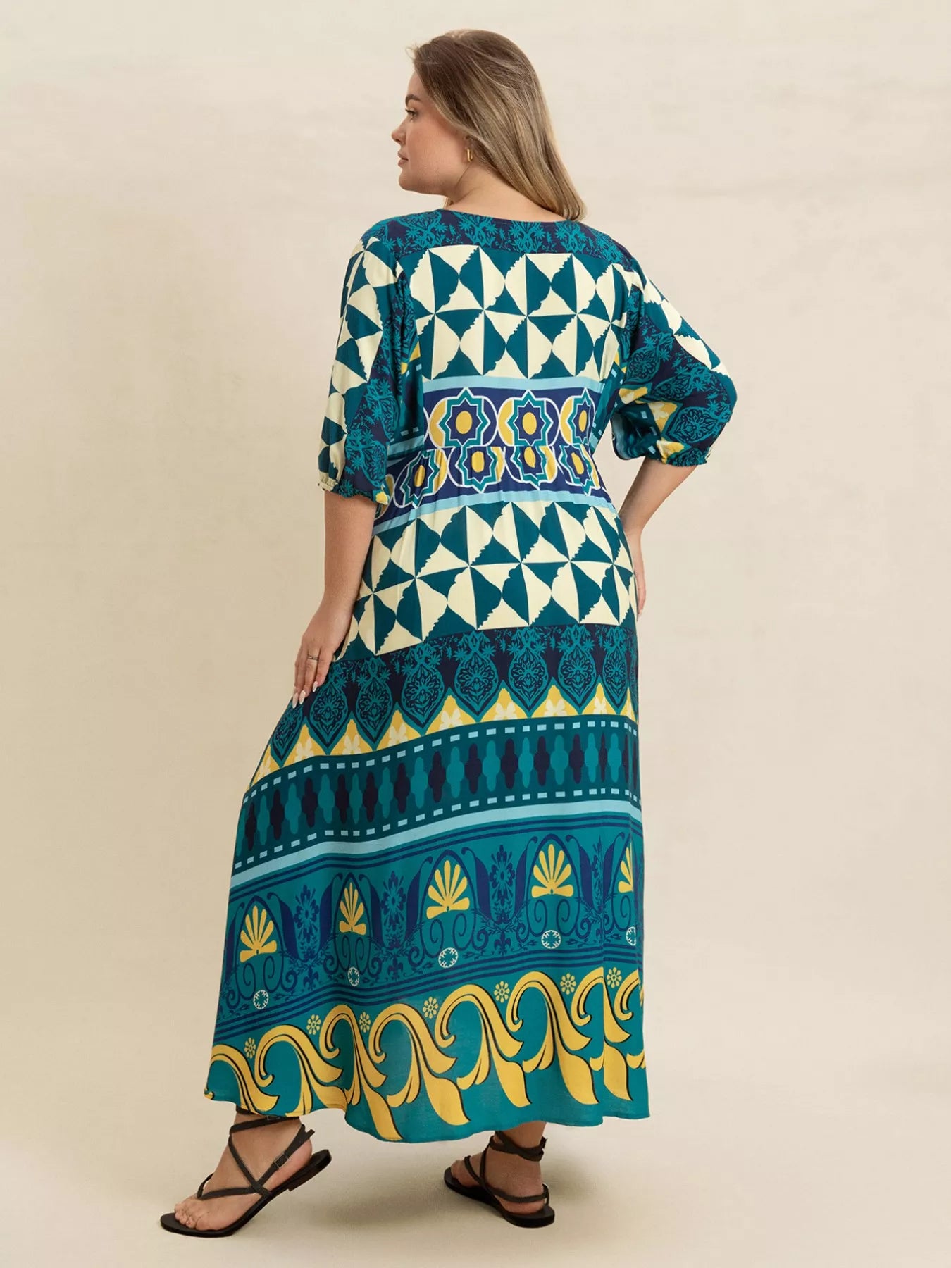 Plus size Mediterranean print midi dress in teal, turquoise, and yellow with buttoned V-neckline and flowy fit