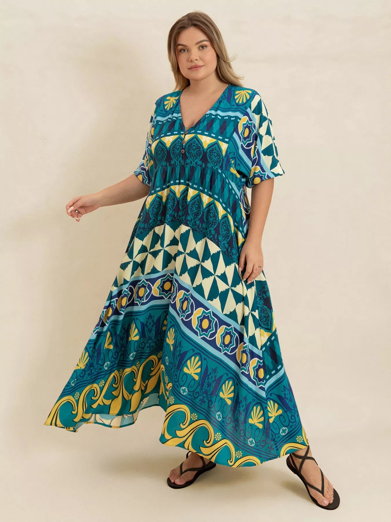 Plus size Mediterranean print midi dress in teal, turquoise, and yellow with buttoned V-neckline and flowy fit