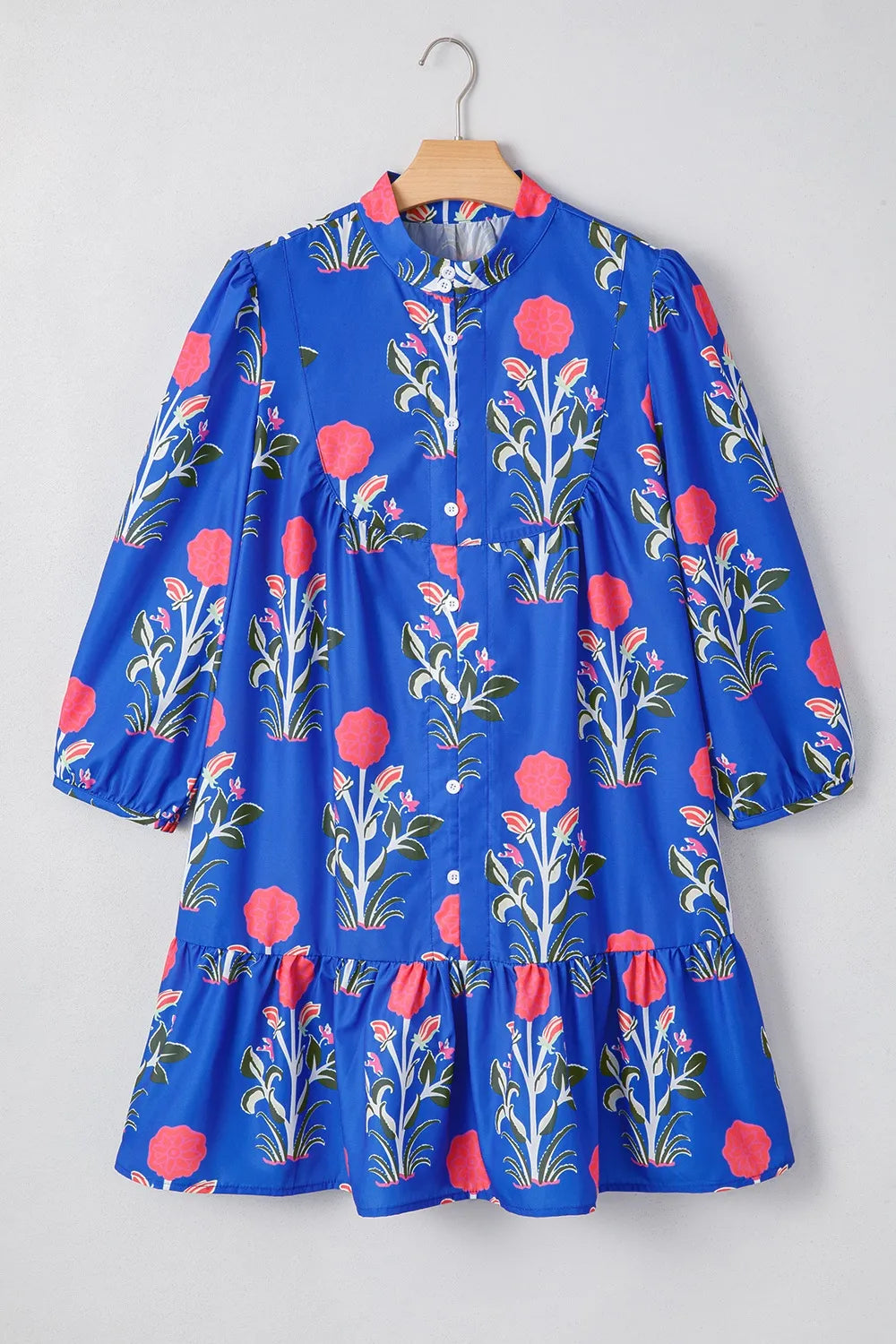 Cobalt blue long sleeve dress with pink floral print and ruffle hem – Midnight Bloom style from A Whimsical Affair.