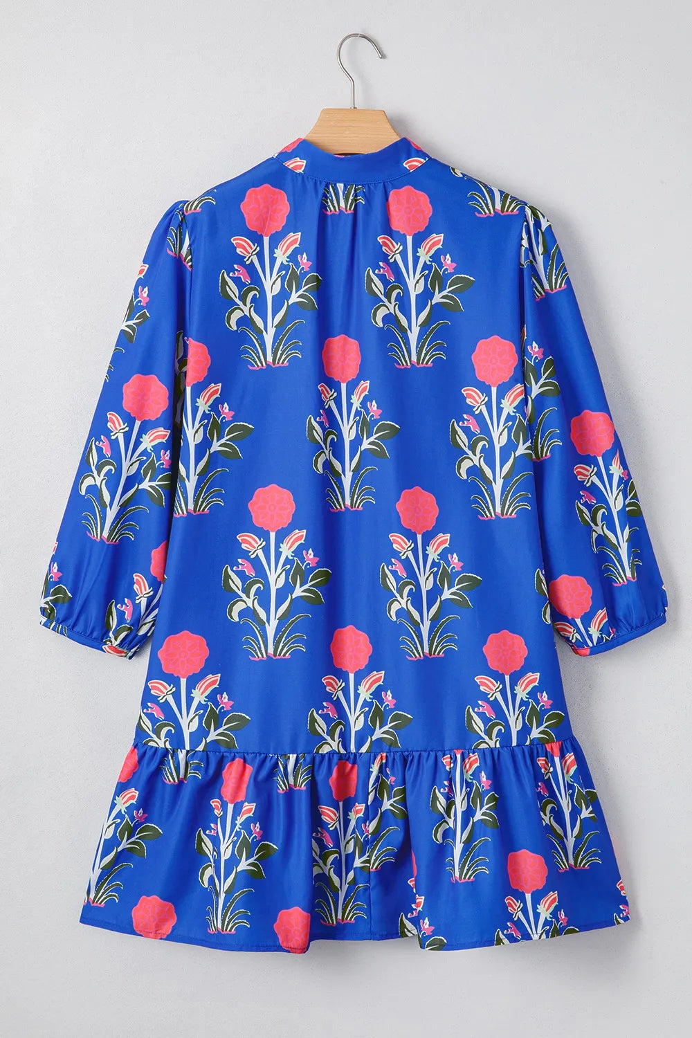 Cobalt blue long sleeve dress with pink floral print and ruffle hem – Midnight Bloom style from A Whimsical Affair.