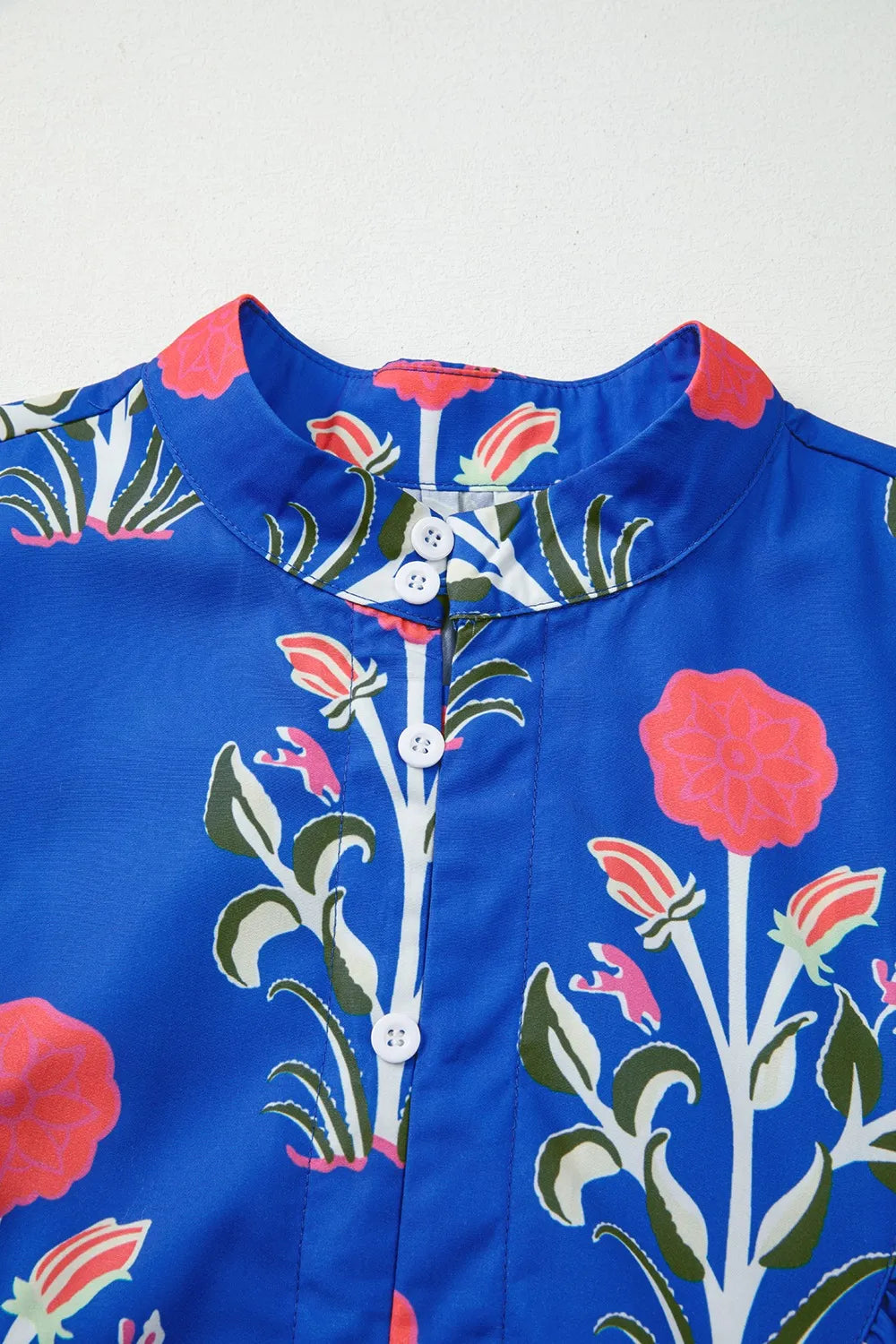 Cobalt blue long sleeve dress with pink floral print and ruffle hem – Midnight Bloom style from A Whimsical Affair.