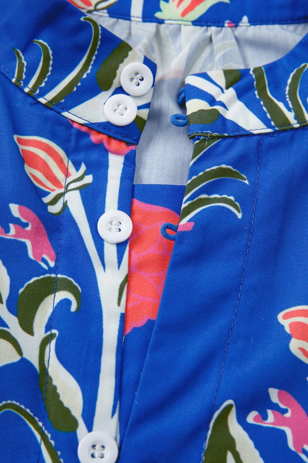 Cobalt blue long sleeve dress with pink floral print and ruffle hem – Midnight Bloom style from A Whimsical Affair.