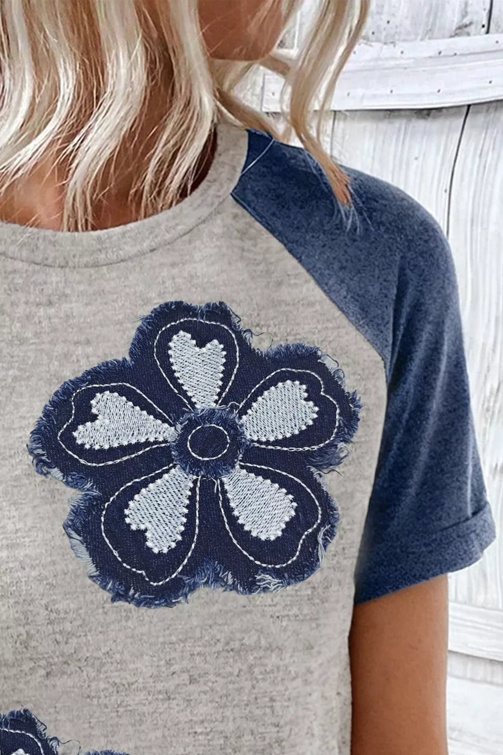 heather gray raglan t-shirt with oversized distressed navy daisy floral appliqué and blue sleeves