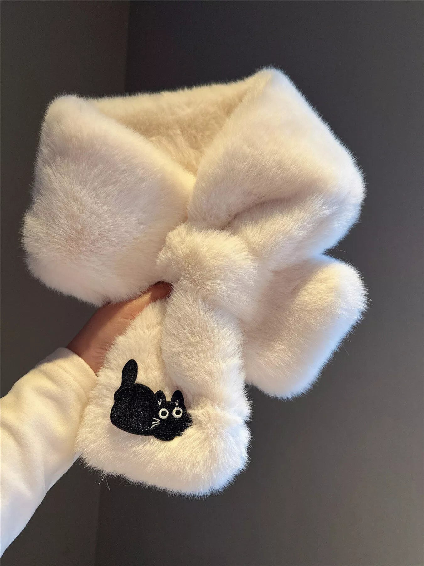 Cream plush scarf with a black kitty patch, soft and cozy winter accessory