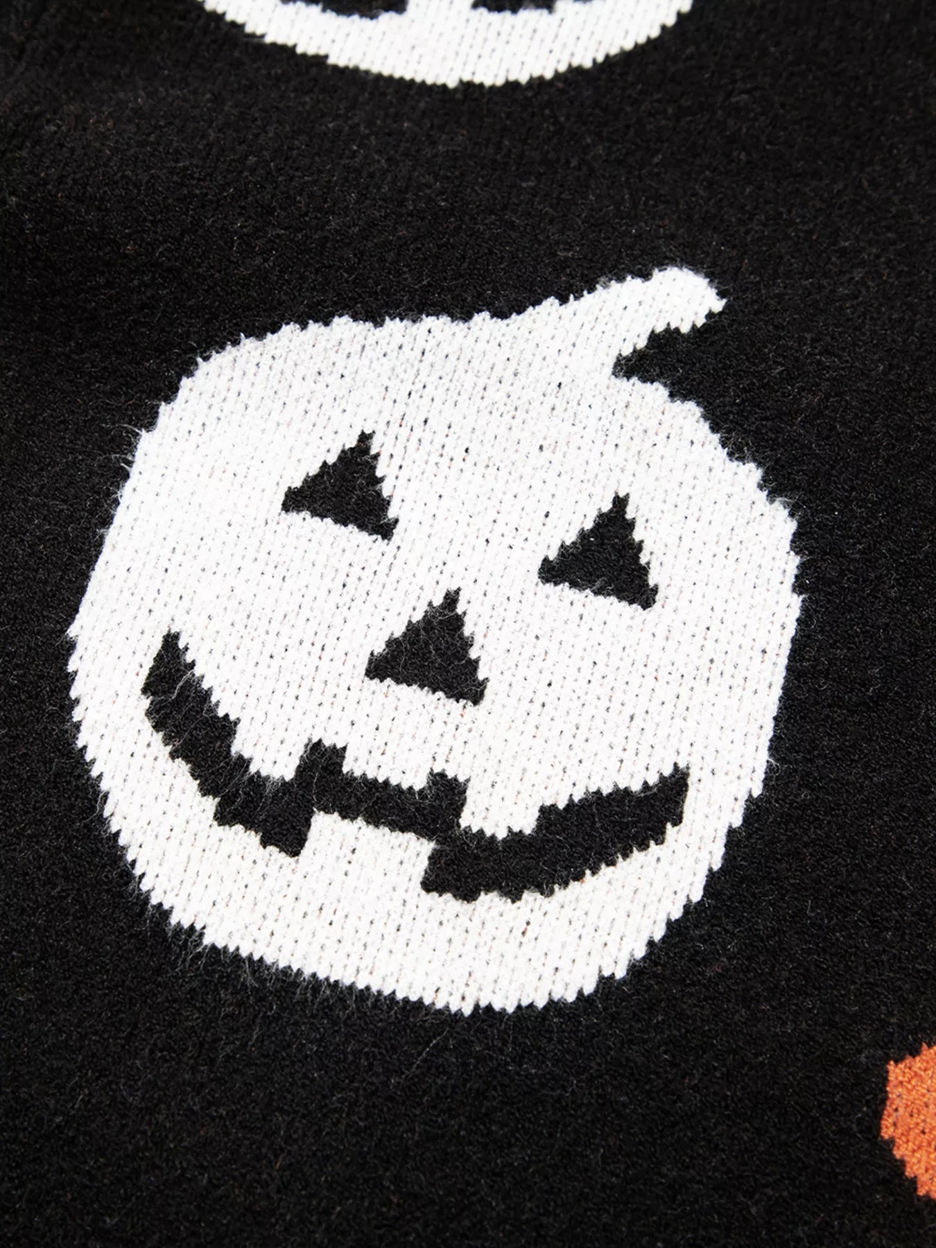 Black Halloween sweater with jack-o’-lanterns, moons, stars, and flowers – Midnight Magic style from A Whimsical Affair.
