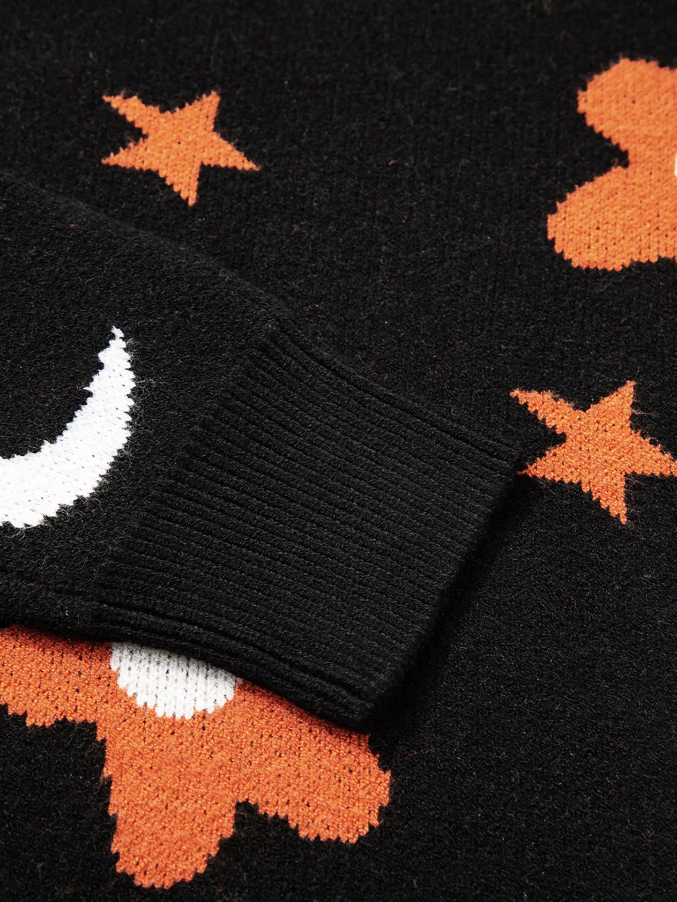 Black Halloween sweater with jack-o’-lanterns, moons, stars, and flowers – Midnight Magic style from A Whimsical Affair.