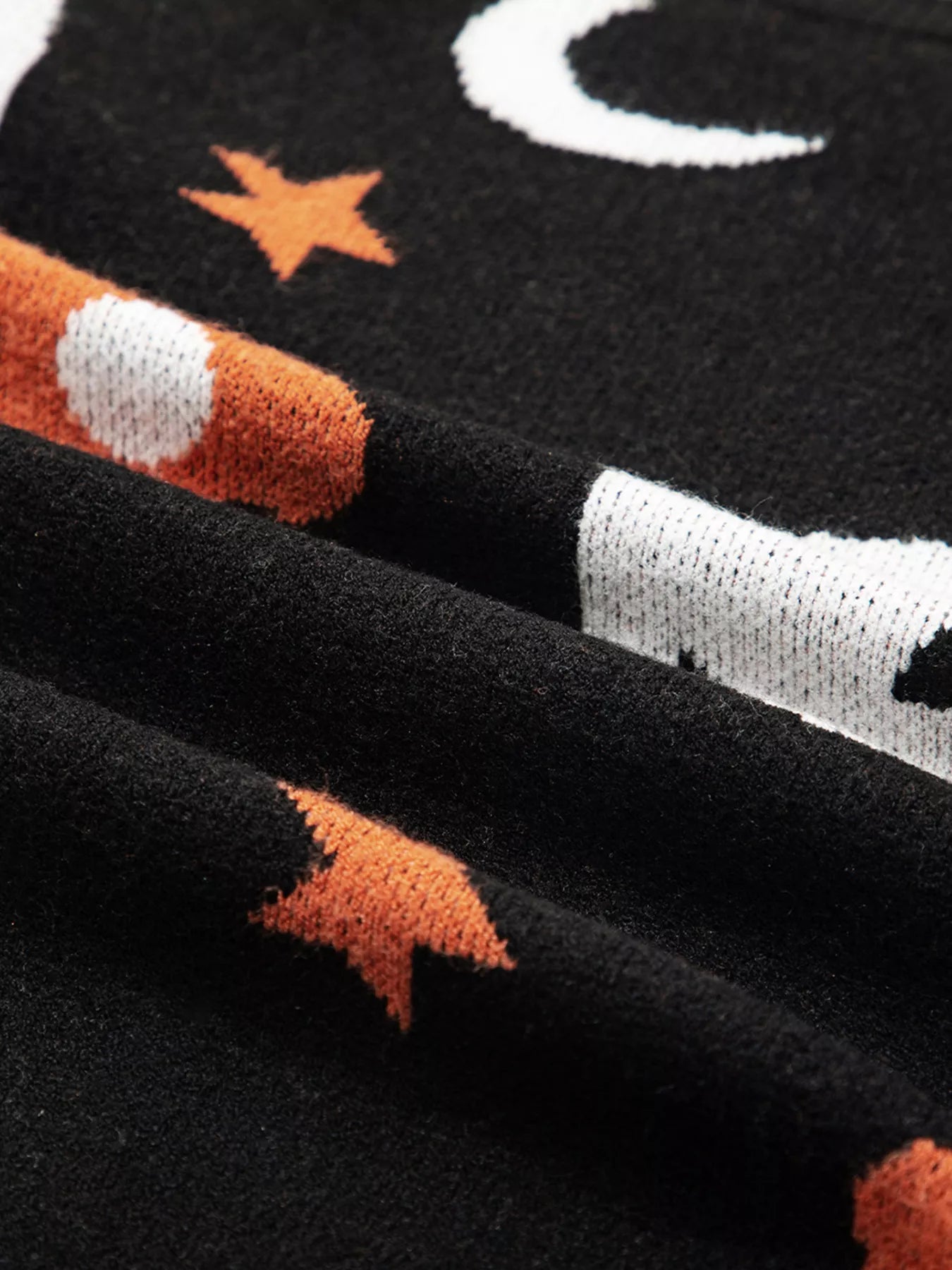 Black Halloween sweater with jack-o’-lanterns, moons, stars, and flowers – Midnight Magic style from A Whimsical Affair.