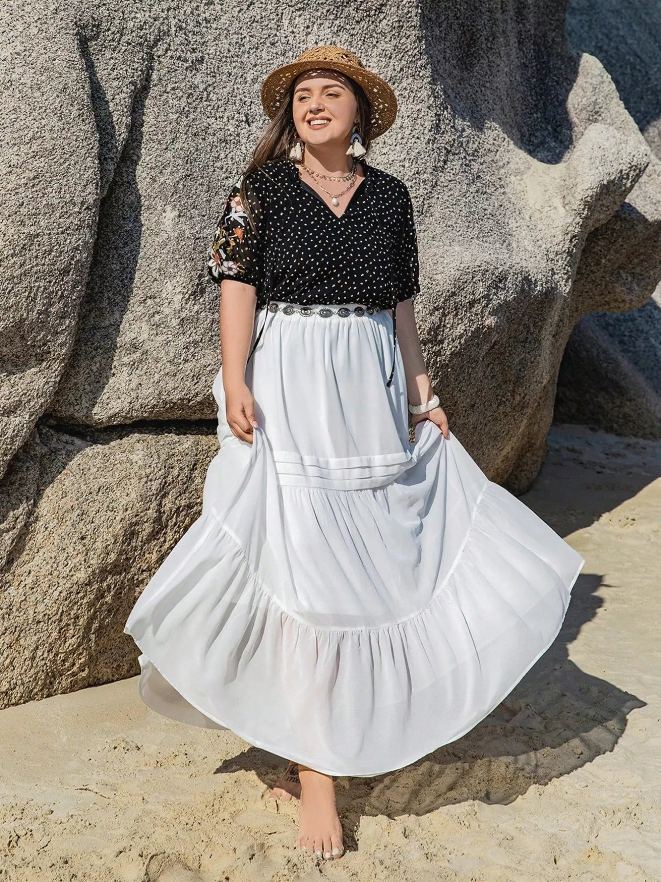 Plus size black embroidered tie top with floral sleeves and polka dot pattern – boho chic blouse for casual or dressy outfits.