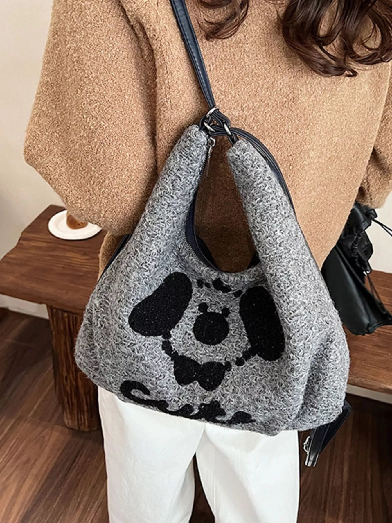 Gray oversized slouch shoulder bag with a soft textured fabric and playful puppy face design