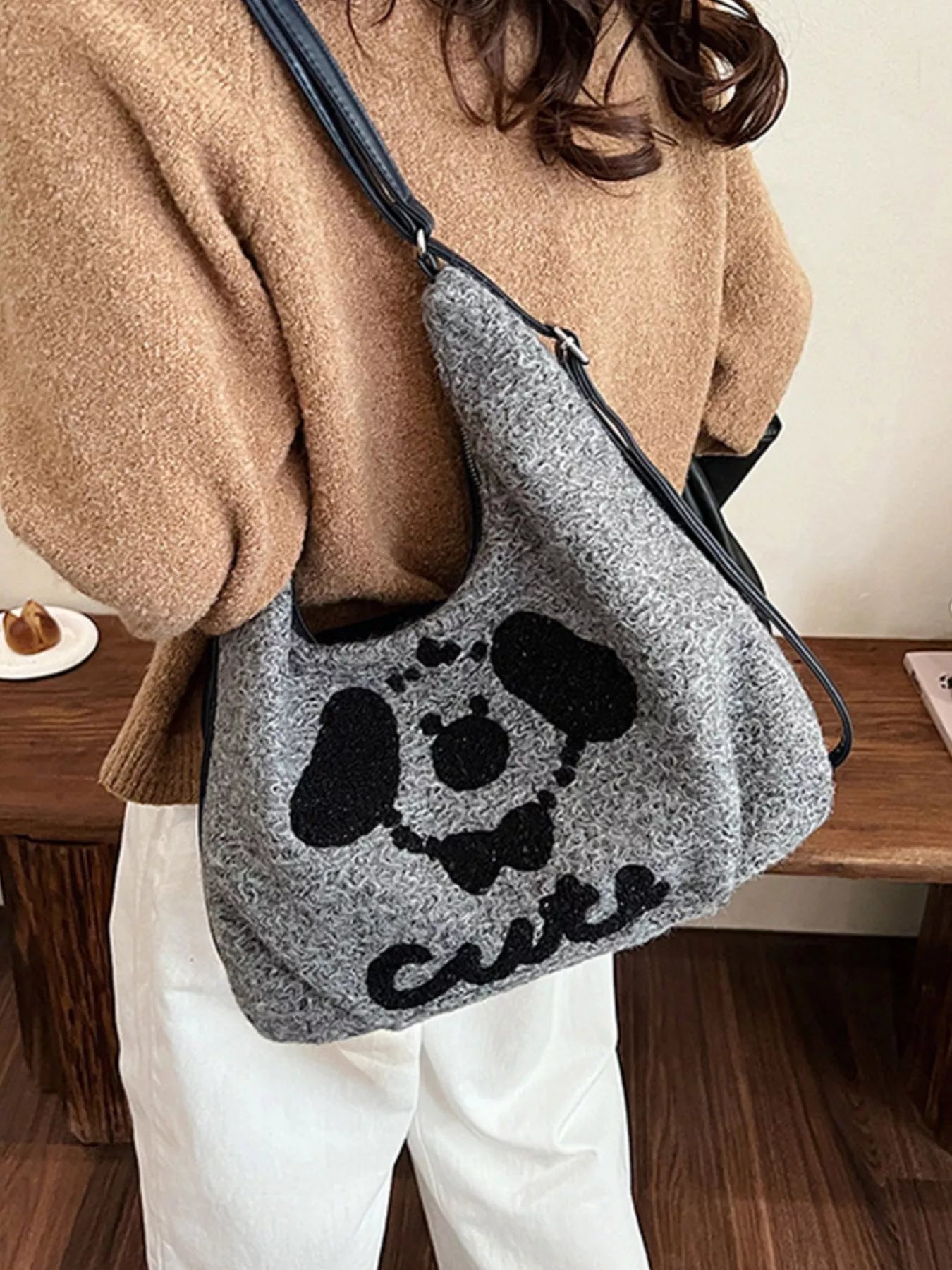 Gray oversized slouch shoulder bag with a soft textured fabric and playful puppy face design