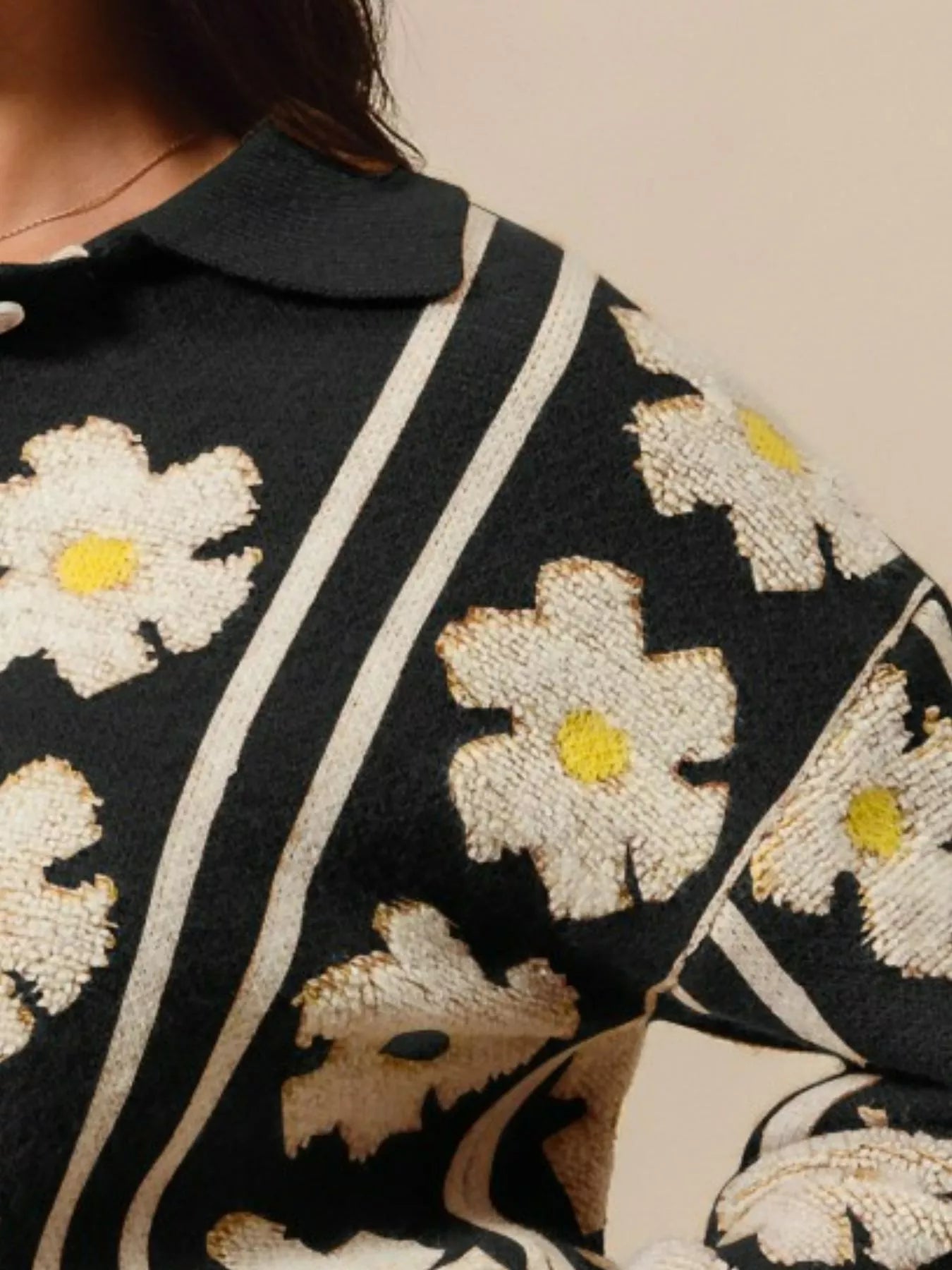 Midnight Verve Floral Stripe Sweater – black knit top with floral and stripe patterns, polo collar, and buttoned neckline.