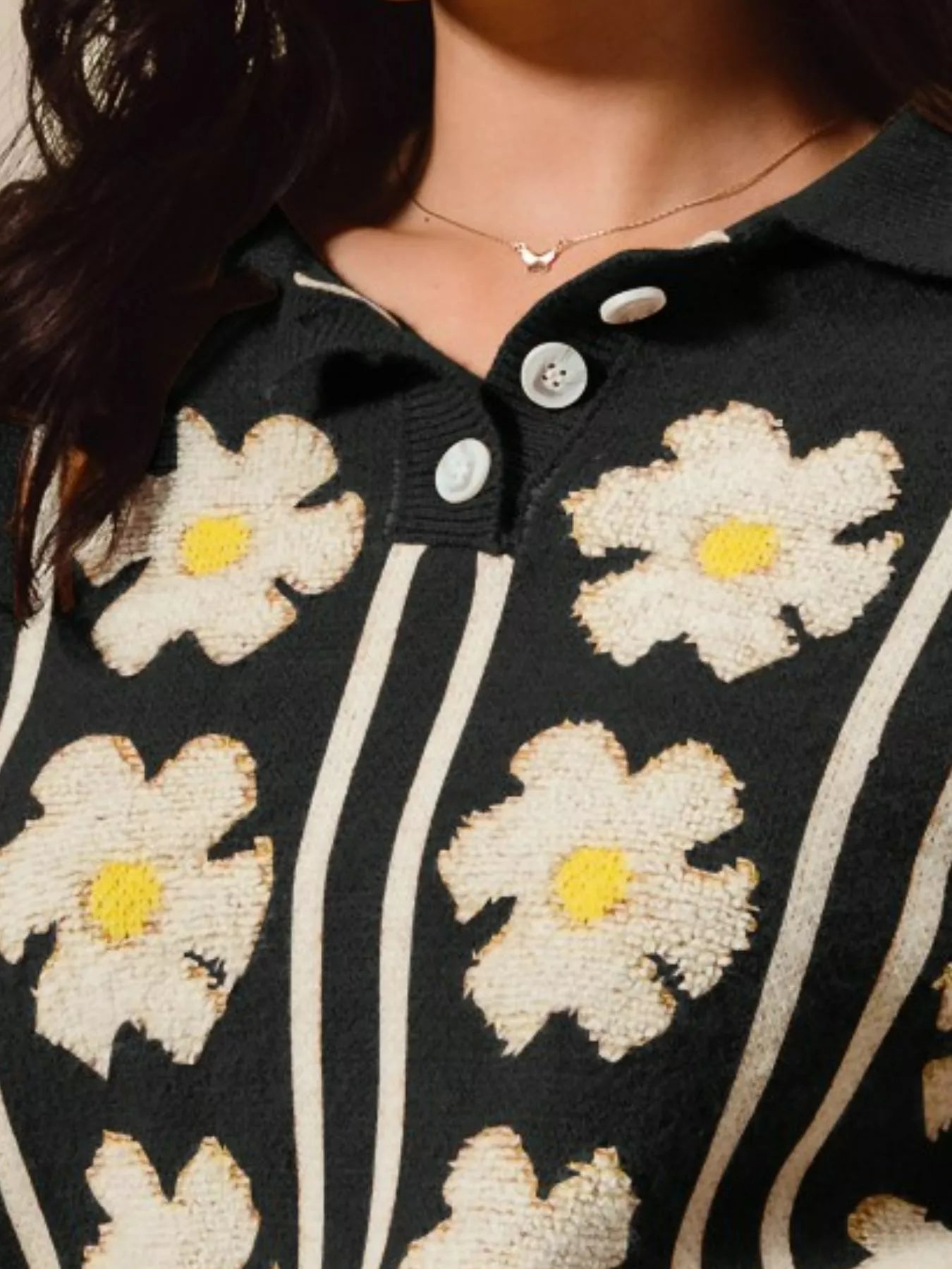Midnight Verve Floral Stripe Sweater – black knit top with floral and stripe patterns, polo collar, and buttoned neckline.