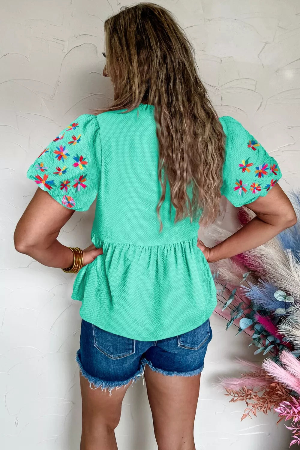 Mint textured peplum top with embroidered puff sleeves