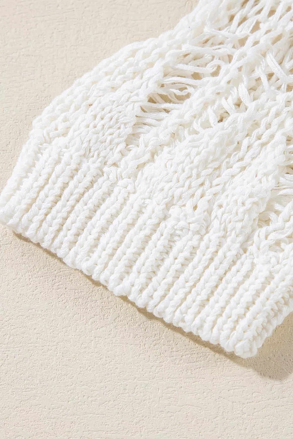 Ivory open knit boho sweater with long sleeves and intricate cutout pattern
